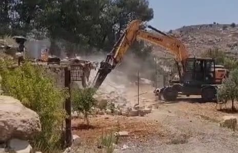 The occupation demolishes a "summer resort" and a water well west of Hebron