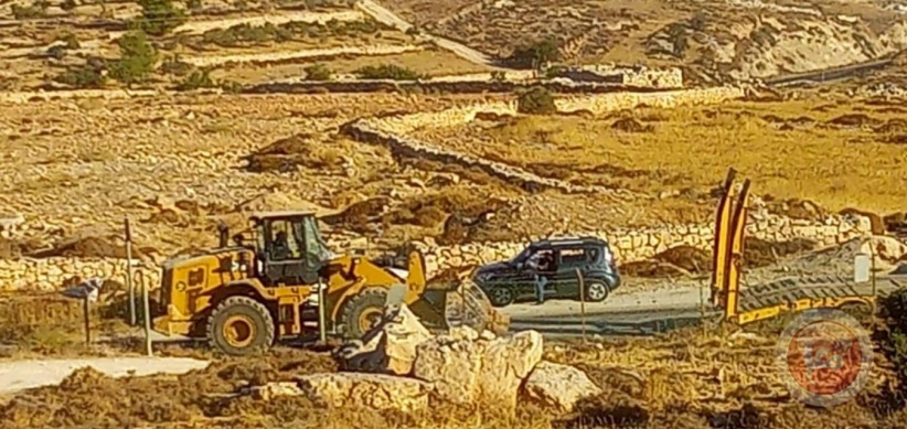 The occupation demolishes a water well, an agricultural room, and uproots trees in the Bani Naim desert